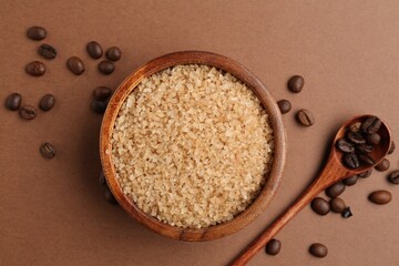 Sea salt and coffee beans on brown background, flat lay