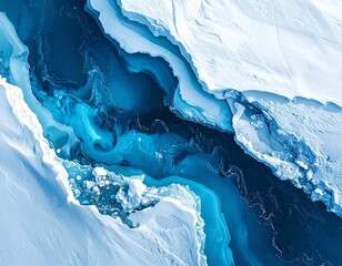 Aerial view of icy blue water and snow formations