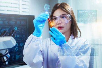 Asian dedicated female scientist examines a red liquid sample in a test tube, with an overlay of a virus particle and laboratory data digitally projected in her high-tech research setting.