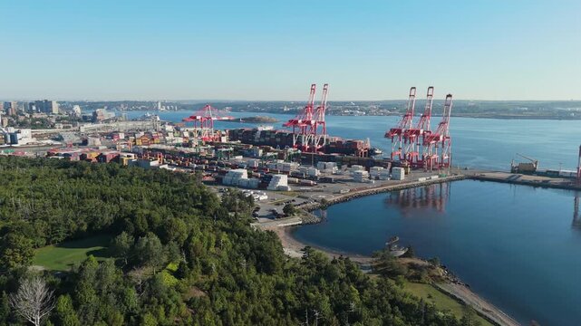 Drone Captures Maritime Logistics Hub Where Containers Are Lifted From Vessel. Halifax Port Is Canada East Coast Deep-Sea Gateway For Import Export Traffic.Cargo Ship Unloading In Halifax Nova Scotia