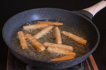 Crispy Potatoes Being Fried in Non-Stick Pan — Hot Cooking Process and Homemade Snack Preparation Concept
