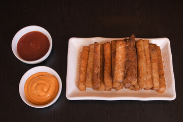 Crispy Potato Fries Served on White Rectangular Plate with Bowls of Ketchup and Mayonnaise — Delicious Fast Food and Snack Concept