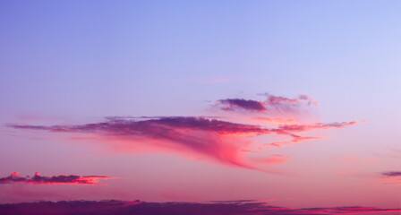 Sky canvas capturing a stunning gradient of magenta, violet, and soft blue hues, highlighting a...