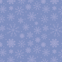 Snowy winter seamless pattern of hand drawn snow flakes on light blue background