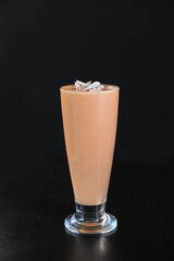 Glass of Fresh Papaya Juice with Chopped Almonds on Top — Healthy Beverage and Nutrition Concept