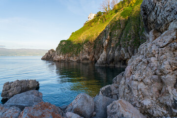 KRK Island, Vrbnik, Croatia - April 19, 2025: Panorama of mountains and water. Beautiful mountain horizon with cliffs and sea.