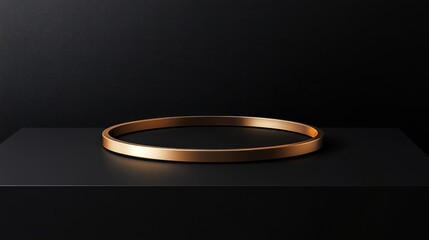 Gold ring on black platform, dark background; product display