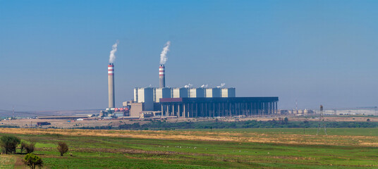 A view towards a thermal power station on the high veldt east of Johannesburg, South Africa in Springtime