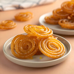 Fototapeta premium Golden Syrup Jalebi: Authentic Indian & South Asian Spiral Dessert Treat Presentation