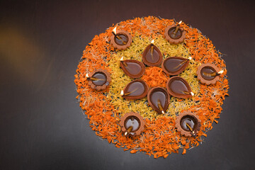 Twelve Lighted Diyas Arranged in Two Different Forms on Flower Buds — Indian Festival of Lights and Spiritual Celebration Concept