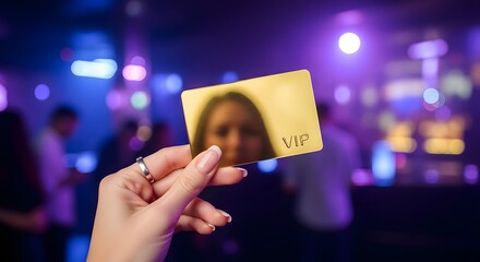 Woman holding a gold vip card in a nightclub with purple lights