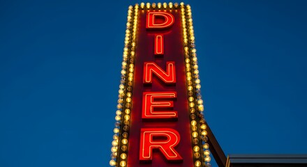 Retro neon diner sign glowing red against a clear blue evening sky