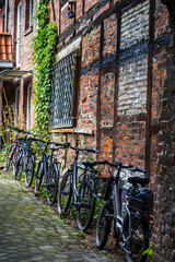 Bicycles parked in an alley, Lüneburg, Germany