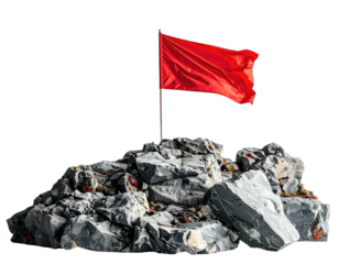 Red flag atop a pile of rocks