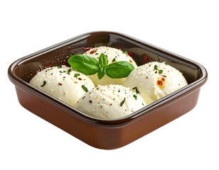Four mozzarella balls in a baking dish