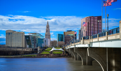 Hartford, Connecticut downtown city skyline with the Bulkeley Bridge spanning the Connecticut...