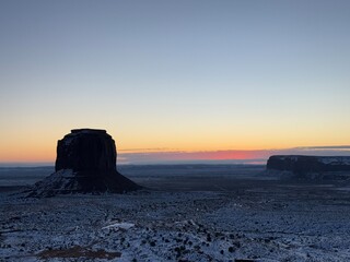 Snow-covered Monument valley at sunrise.