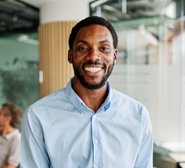 Obraz premium Portrait of a young businessman having a meeting in the office. Portrait of a smart young businessman