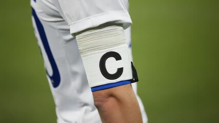 Captain's armband of a soccer player. - Powered by Adobe