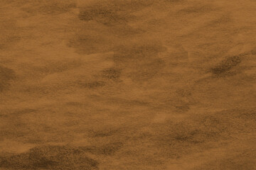 Detailed close-up of a warm, earthy brown textured surface, perfect as a natural abstract background for design projects. Soft, grainy pattern with subtle gradients