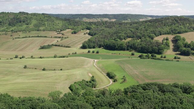 Aerial Drone Forward Flight With Parallax Effect Over Rural Agricultural Landscape And Forest, 4K