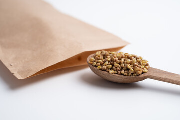 Buckwheat tea, herbs on a wooden board with a spoon. Tea ceremony. Herbal treatment.