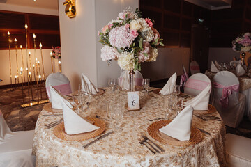 elegant table with plates and a flower centerpiece