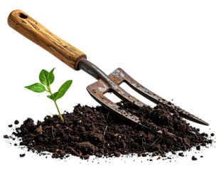 A garden fork gently inserted into dark soil, with a small plant growing nearby