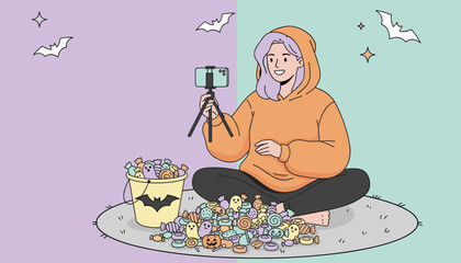 Happy young woman vlogging Halloween candy haul streaming festive social media content