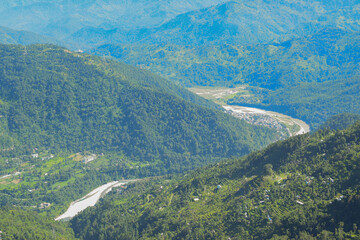 High point view of downstream curvy Tista river flowing through Himalayan mountains, Rinchenpong,...