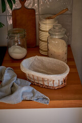 Homemade production of fresh healthy bread of other pastry from natural ingredients on a light grey background.