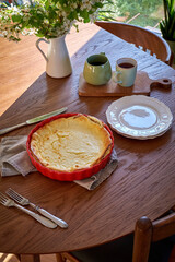 Cottage cheese casserole. Cheesecake in a red form. 