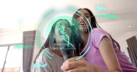 Music cue playing, sisters harmonizing karaoke duet in home, projecting holographic DNA helix data - Powered by Adobe
