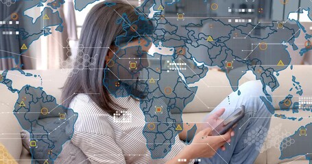 Woman resting and tapping device, starting map overlay with data icons for tracking network - Powered by Adobe