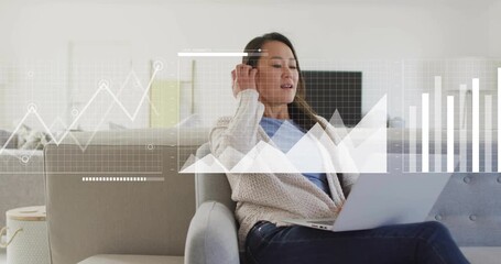 Remote worker gazing at laptop screen and initiating grid overlay and analyzing business chart data - Powered by Adobe