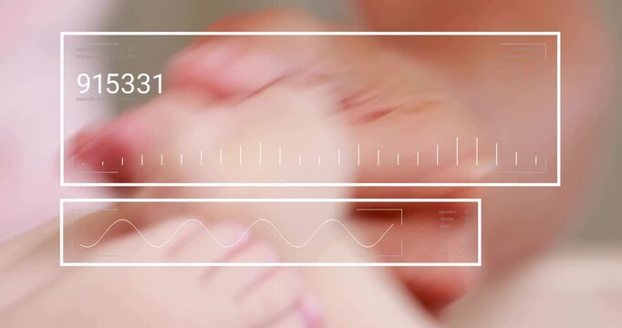 Adult hand flexing baby foot while HUD overlay fades in, updating numeric bars monitoring movement