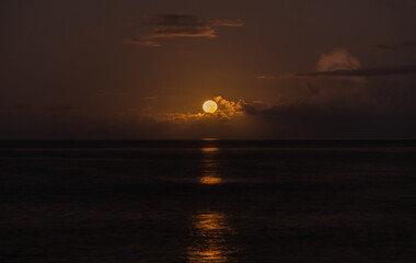 Beautiful full  moon moonset over Pacific ocean on Oahu, Hawaii 