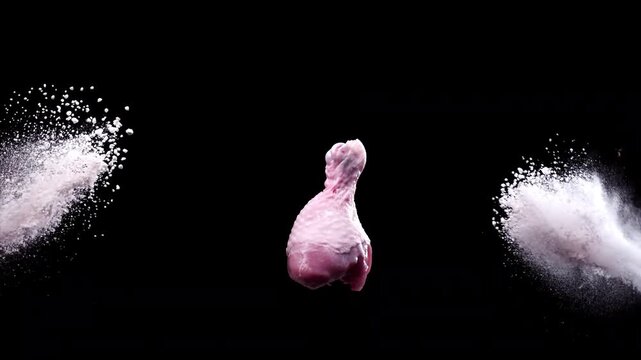 The collision of spices with a chicken drumstick in the air at super slow-motion 1000fps