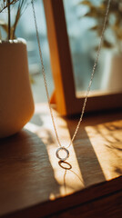 Elegant silver necklace with intertwined rings, a modern jewelry piece symbolizing unity and everlasting love, perfect for fashion and lifestyle themes