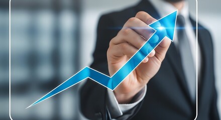Businessman drawing a glowing blue upward trending arrow graph on a transparent screen symbolizing growth and success