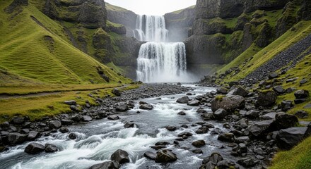 A majestic waterfall cascades down mosscovered cliffs into a rocky riverbed, surrounded by lush green hills in a remote natural landscape