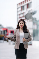 Confident Businesswoman Presenting Outdoors