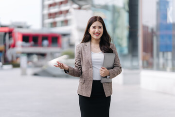 Confident Businesswoman Presenting Outdoors
