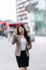 Excited Businesswoman with Idea in City