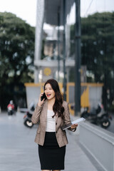 Confident Businesswoman Talking on Phone Outdoors