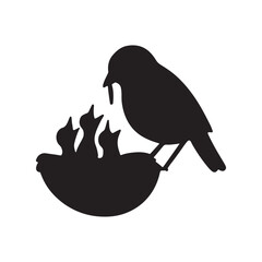 Mother bird feeding chicks in a nest silhouette vector, a symbol of family love and care