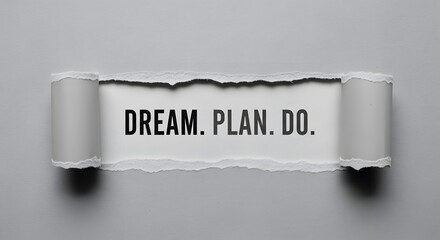 Empowering message revealed under torn paper inspires action, encouraging people to dream big, plan strategically, and execute their goals for success