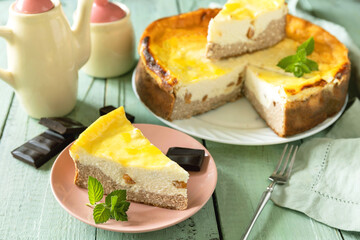 Delicious lemon cheesecake with tea set for dessert presentation.