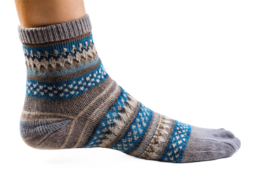 Closeup of a person wearing a grey and blue patterned knit sock with an open toe, isolated on transparent background.png