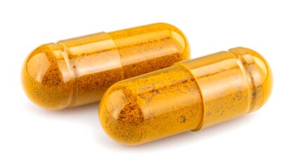 Two transparent, amber-colored capsules filled with orange-yellow powder, isolated on white